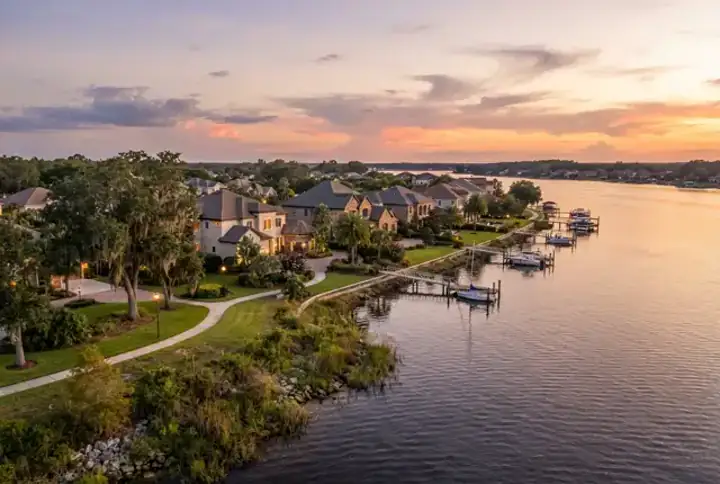Fleming Island FL waterfront homes with private boat docks along Doctor's Lake at sunset — website design Fleming Island FL